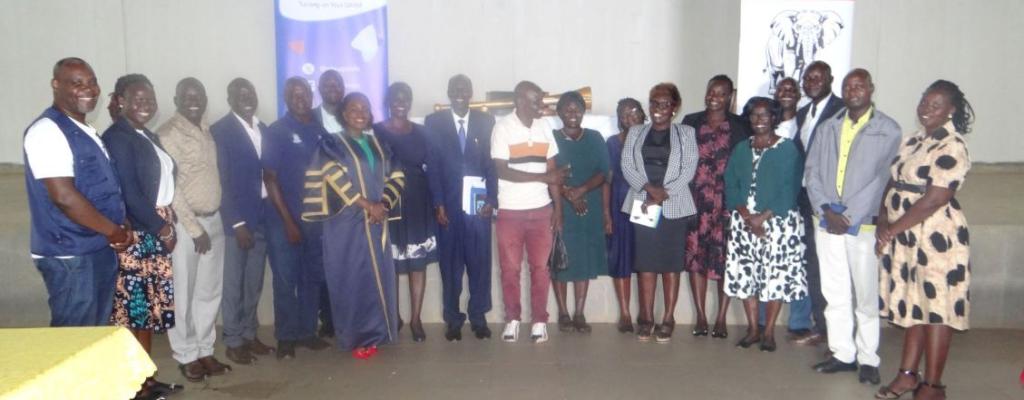 Amuru staff pose for a photo with the NTV crew after NTV people's parliament session